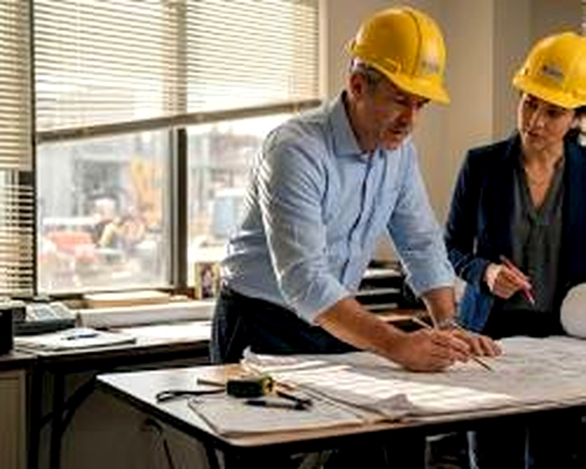 Architectural drawings and blueprints on desk